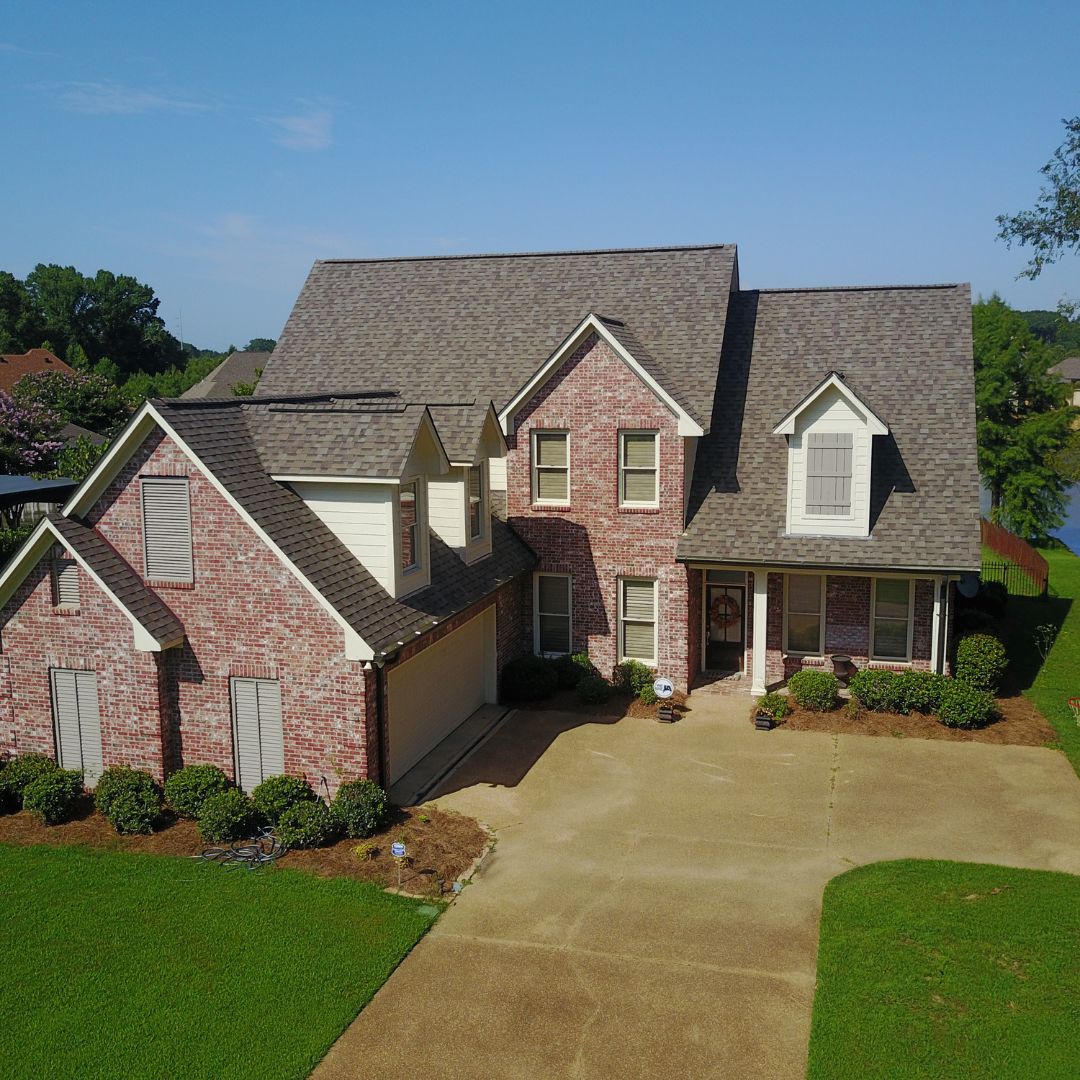 brick home with new roof