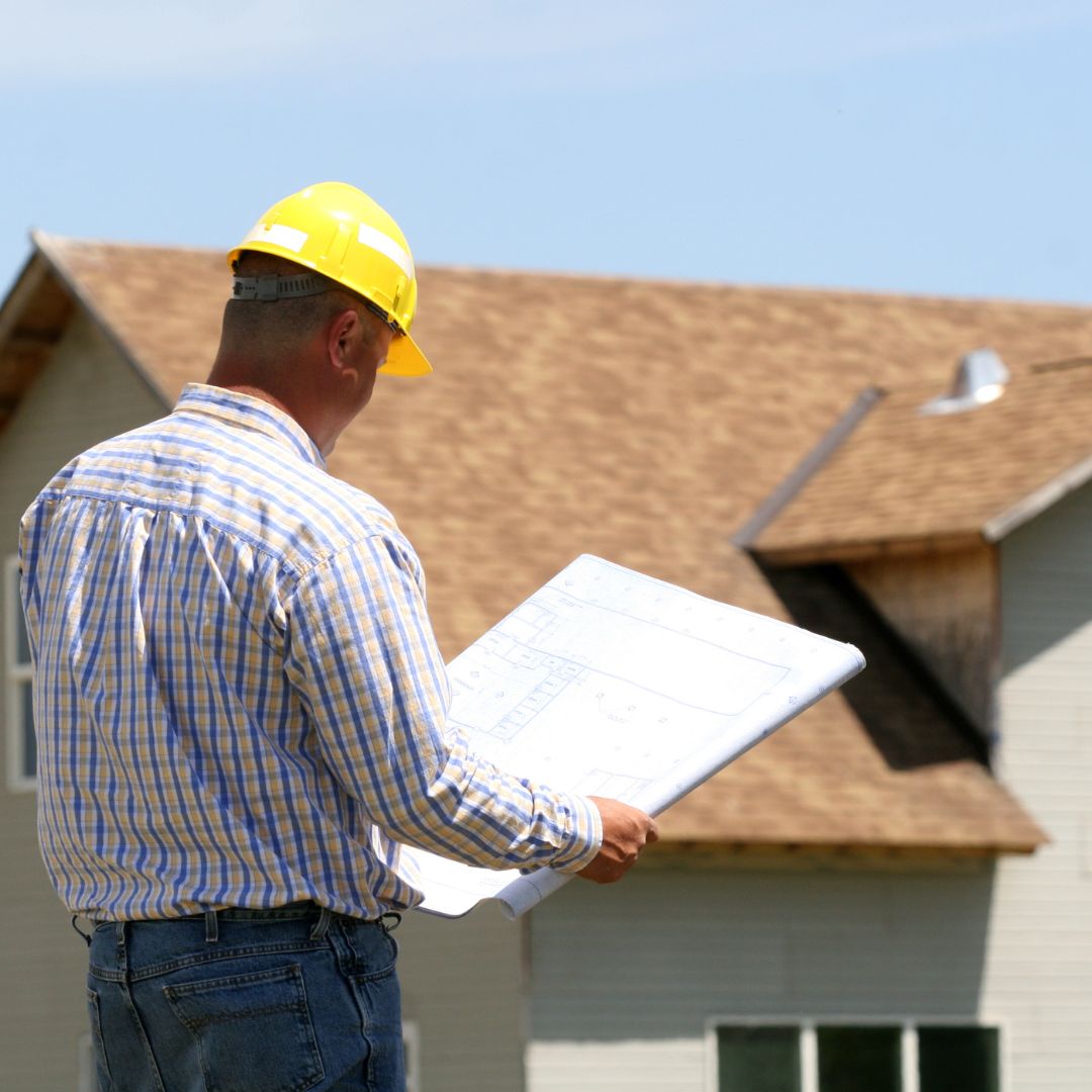 contractor looking at blueprints