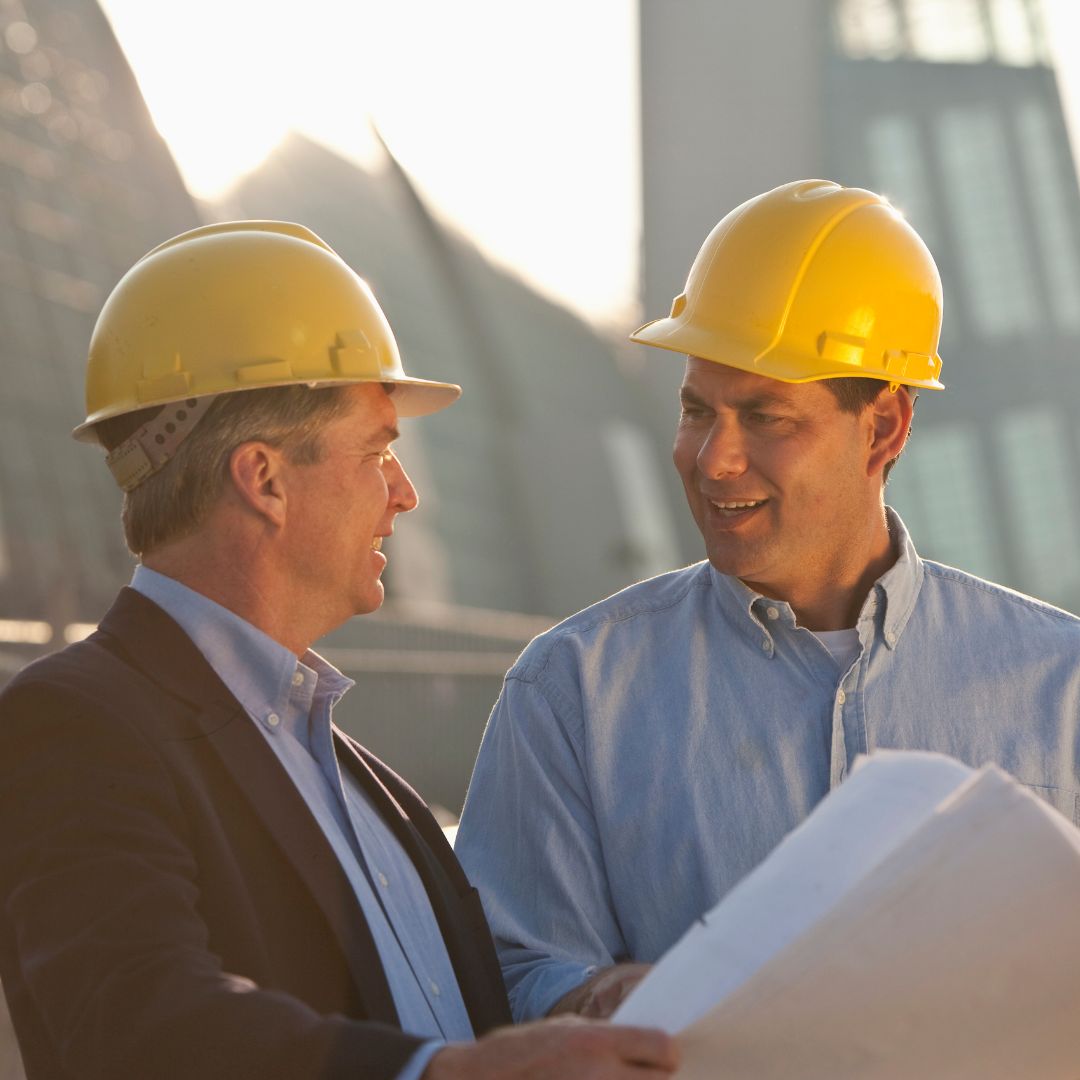 smiling people in hard hats