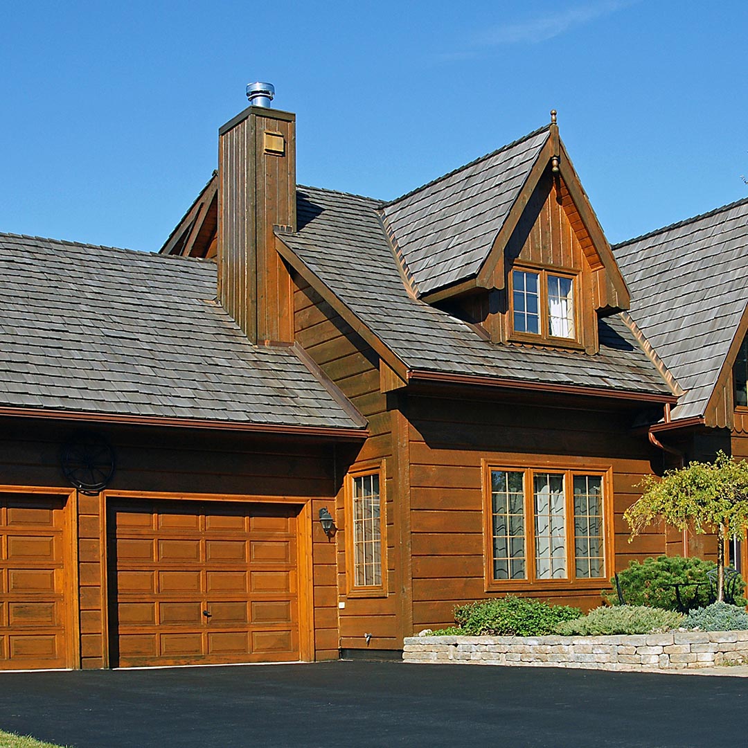 Wood house with gray shingle roof