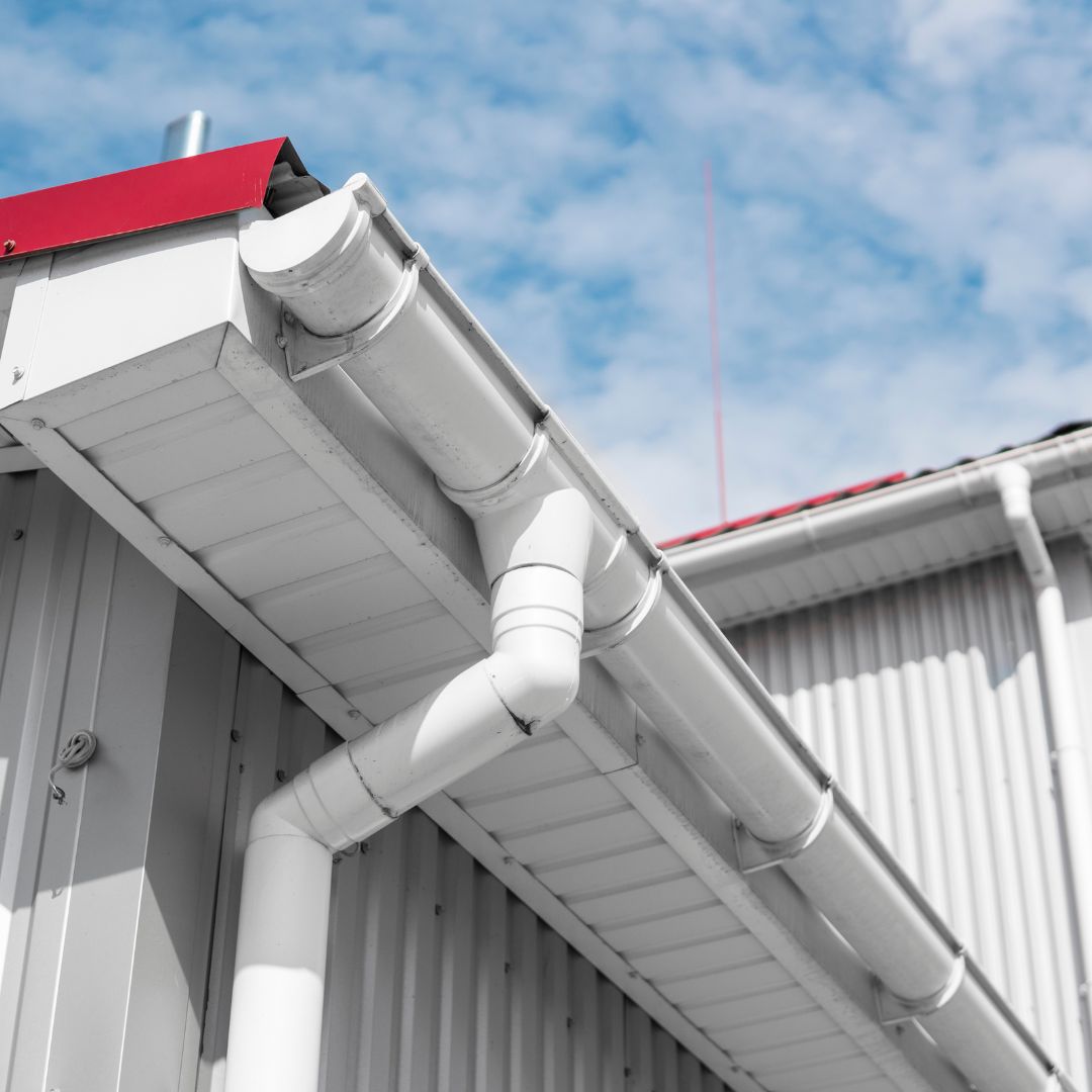 Gutters on a metal commercial building's roof