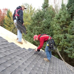 roofing contractor installing new shingles