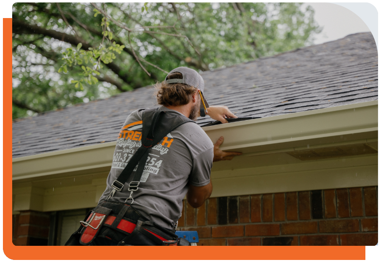 Strength Roofing & Siding worker working on gutters